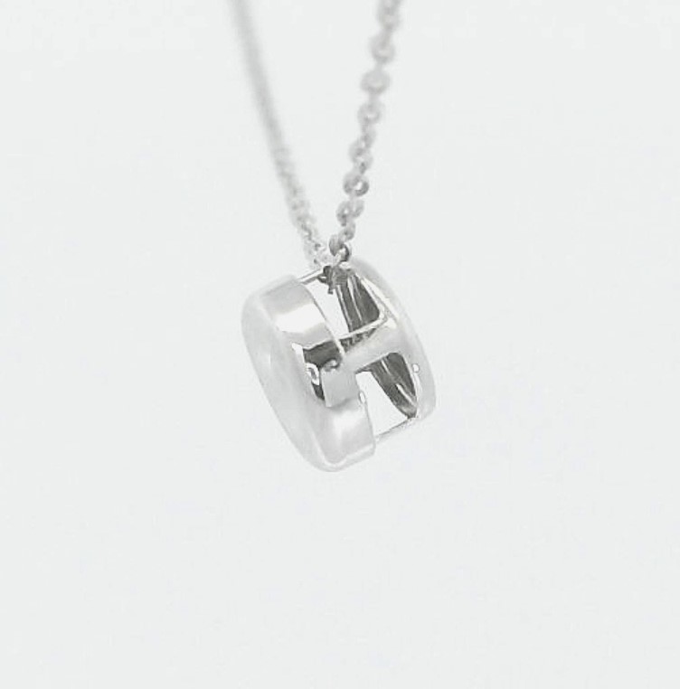 COLGANTE CHATON ORO BLANCO ESTAMPACION 5MM.BRILLANTE H-SI 1.0.07CT