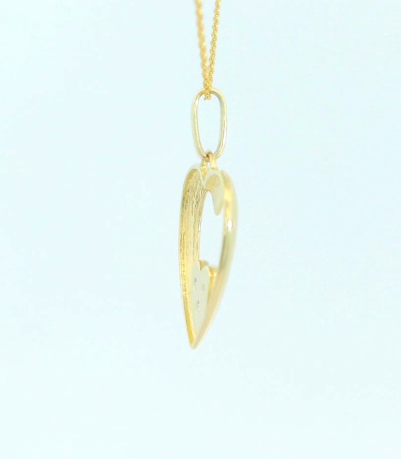 COLGANTE DOS CORAZONES CON CIRCONITAS.14x13MM. 9KILATES