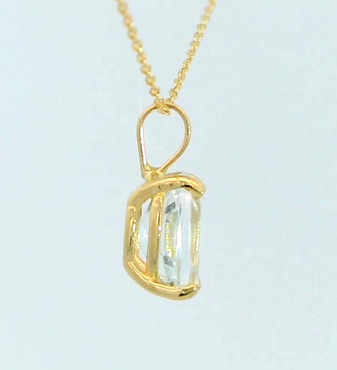 COLGANTE TOPACIO BLANCO OVAL 7x5MM. 9 KILATES
